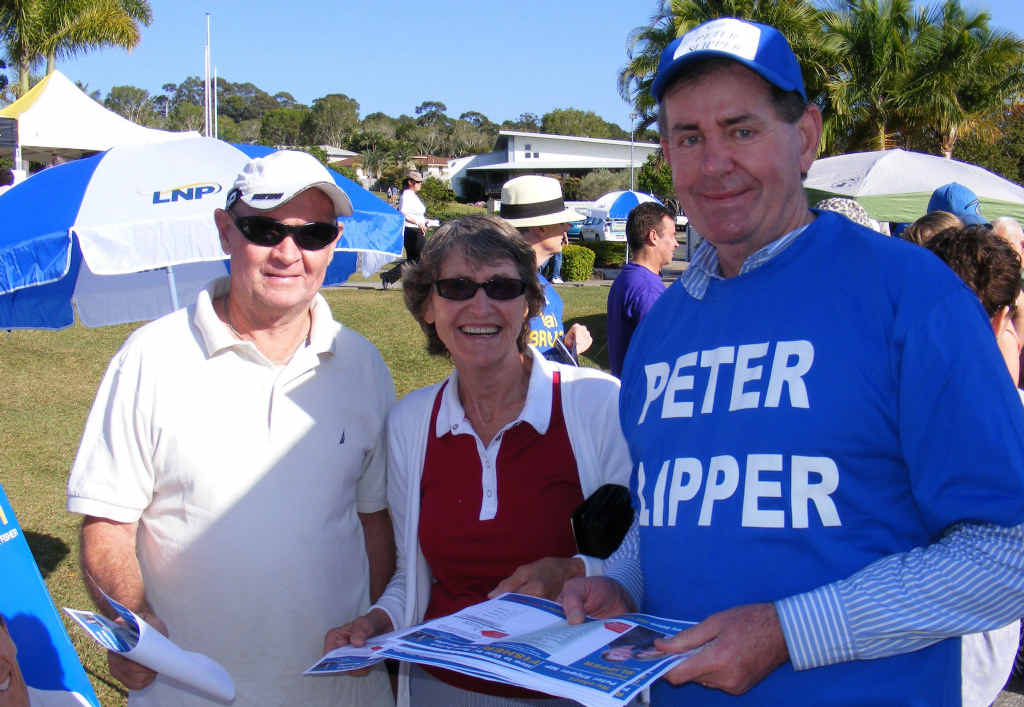 Peter Slipper hands out his how-to-vote cards to Frank Curley and Ana Velvick yesterday at Siena College in Sippy Downs. Peter Slipper hands out his how-to-vote cards to Frank Curley and Ana Velvick yesterday at Siena College in Sippy Downs.